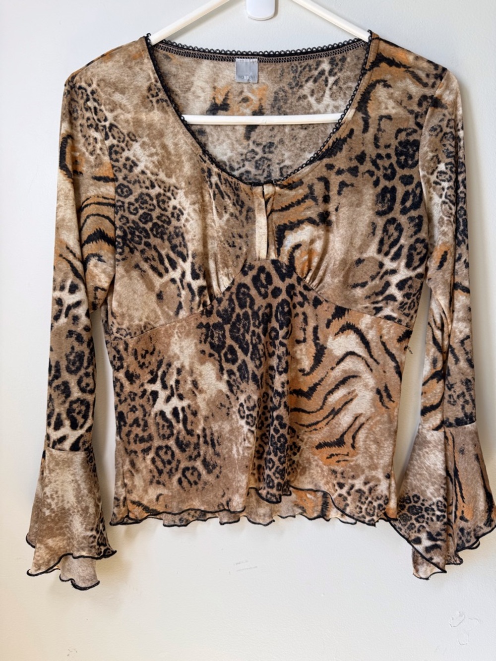 Sasson sheer Y2K animal print babydoll top with long flare sleeves lettuce hem.